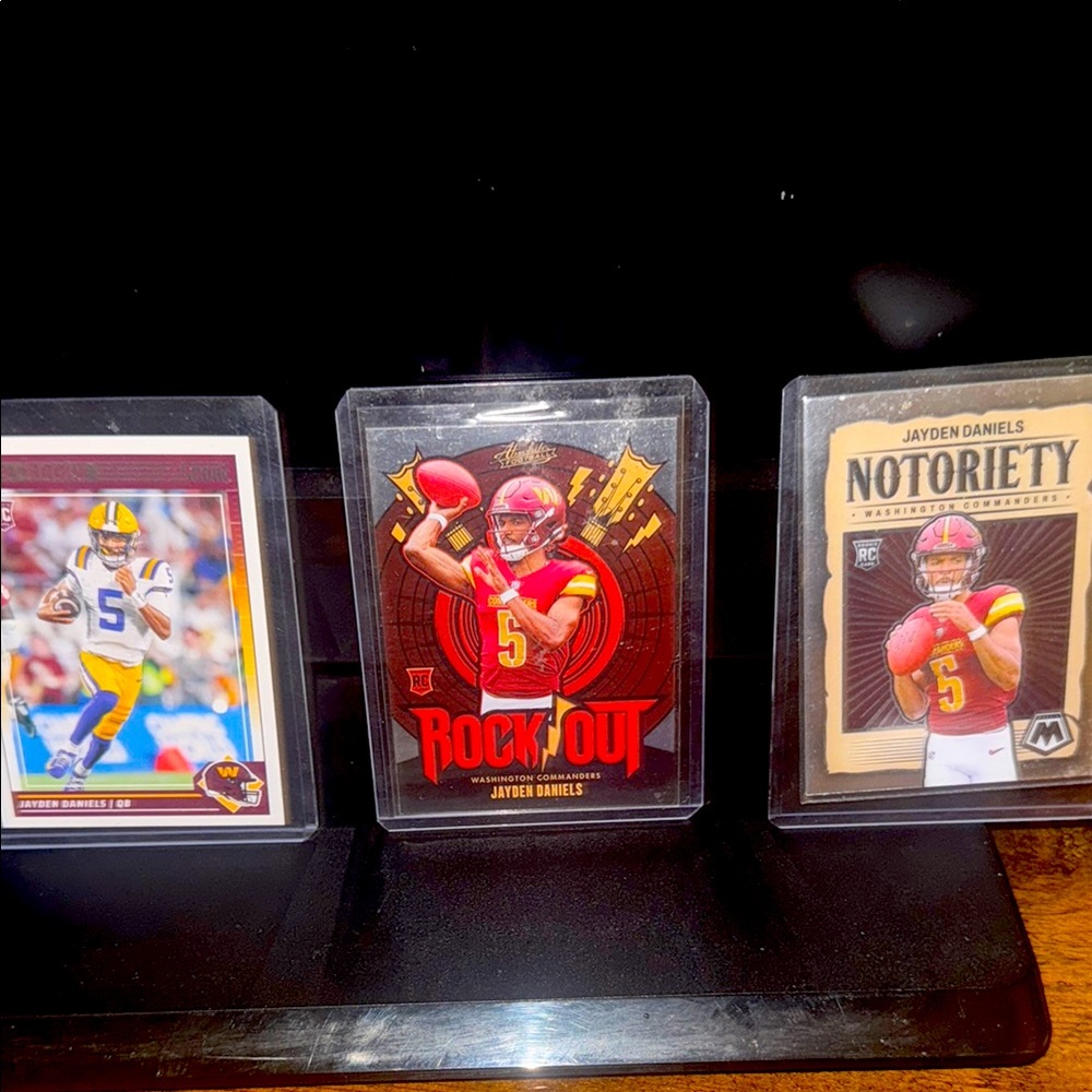 Jayden Daniels three card rookie lot. Featuring three of his best rookies.